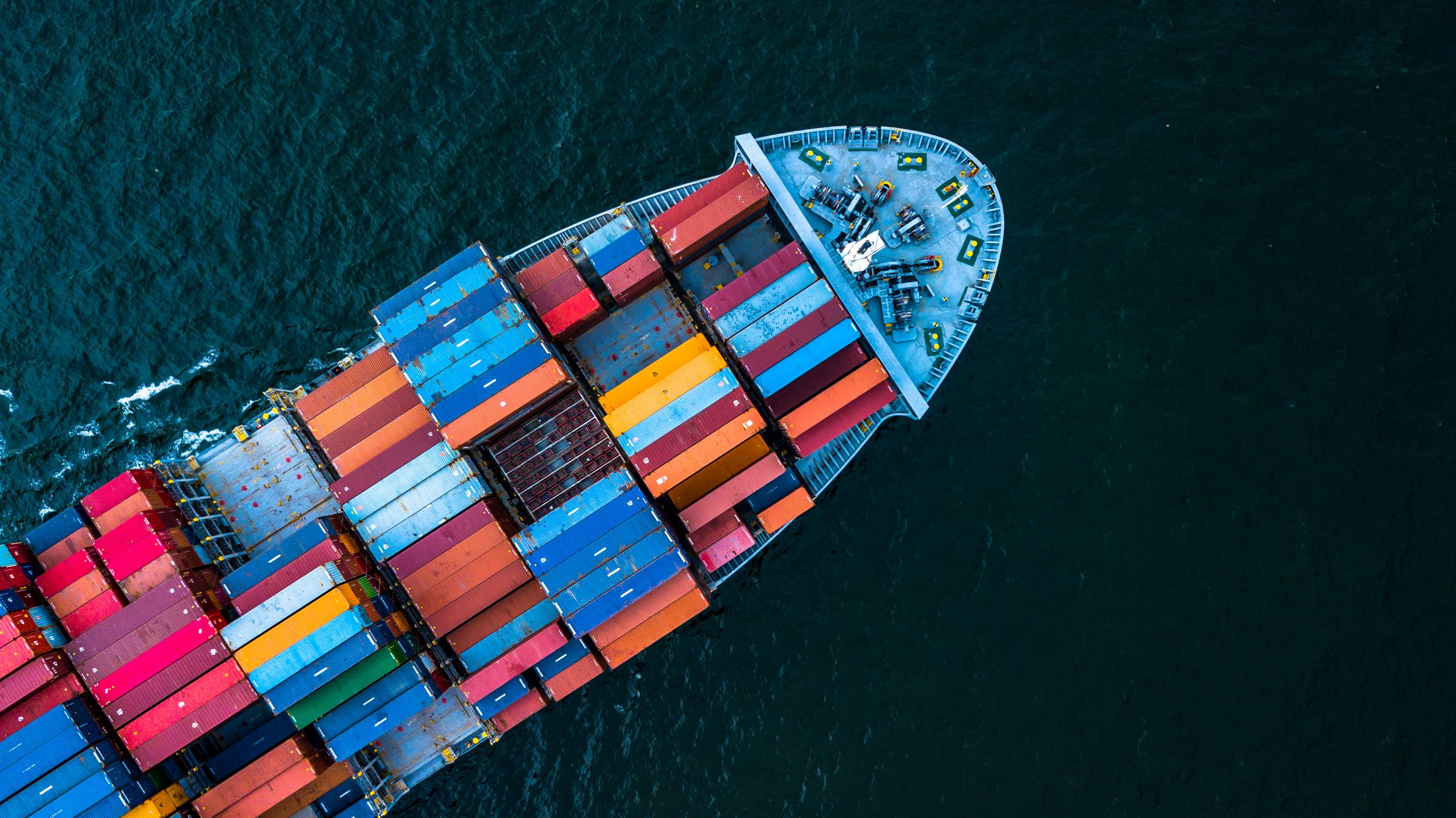 aerial photo of a ship carrying shipping containers